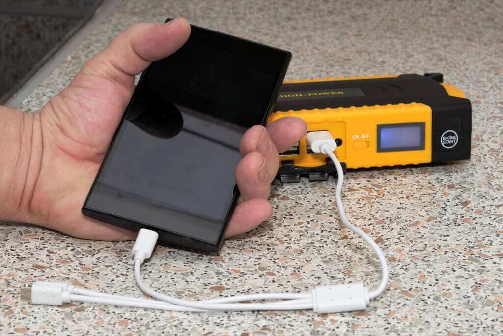 10000mah black smartphone in hand charges from the powerbank 1 10000mah black smartphone in hand charges from the powerbank 1