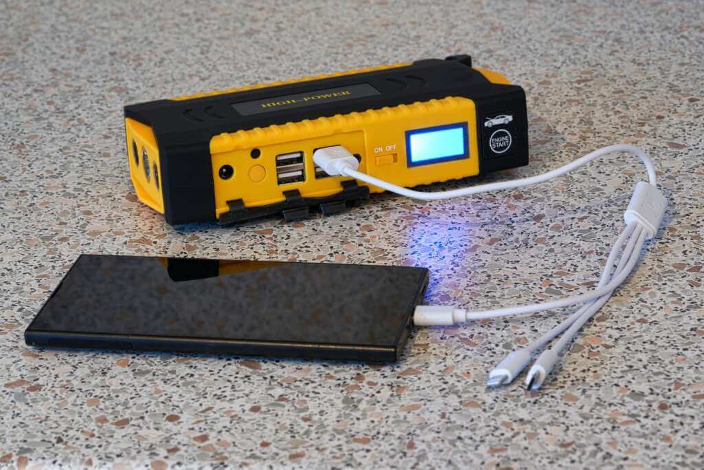 36056492 the smartphone is charged from a power bank via a universal charging cable 1 36056492 the smartphone is charged from a power bank via a universal charging cable 1