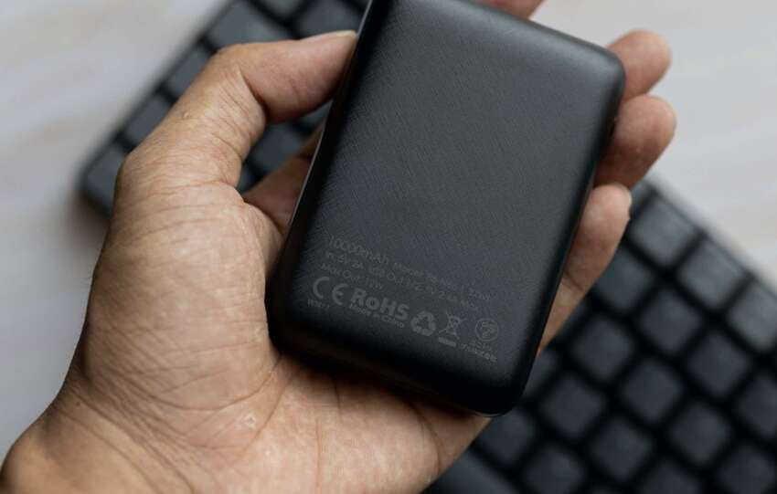 New power bank holding in the hand
