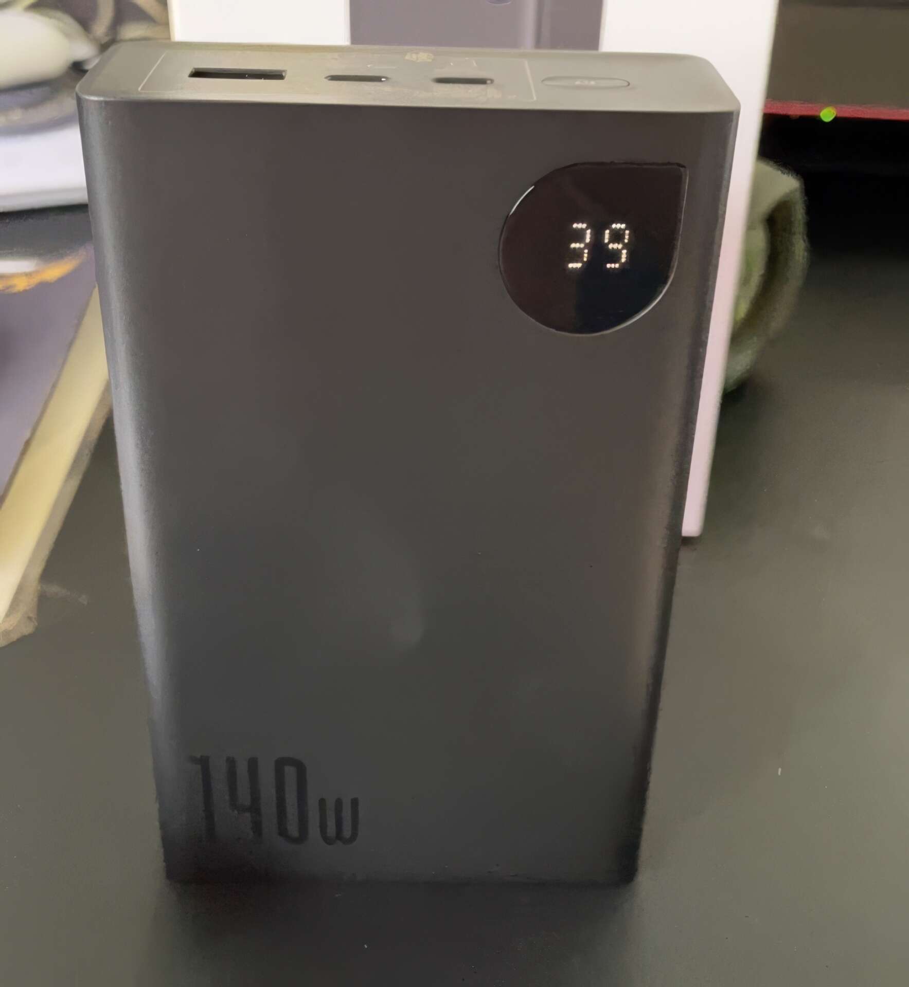 Baseus 140W Portable Charger on the table Baseus 140W Portable Charger on the table